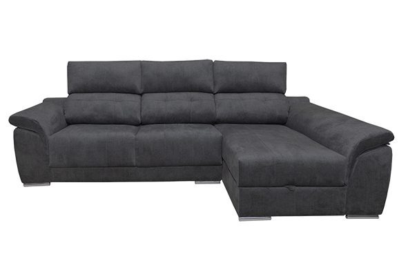 Sofá chaise longue Pirineos de diseño moderno en un salón luminoso, destacando sus respaldos reclinables y el arcón de almacenaje.