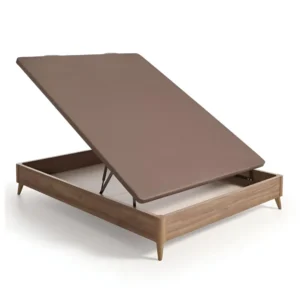 Canapé con patas Modelo Clásico con tapizado en tejido técnico oscuro en un dormitorio, destacando su diseño elevado y robusto.