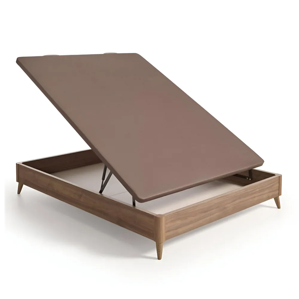 Canapé con patas Modelo Clásico con tapizado en tejido técnico oscuro en un dormitorio, destacando su diseño elevado y robusto.