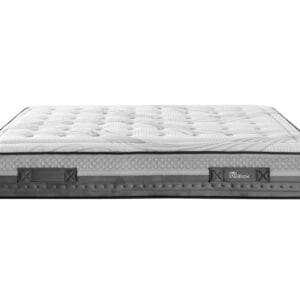 Colchón de muelles ensacados Kodell con tejido Strech de Lurex mostrado sobre una base de cama en un dormitorio luminoso.