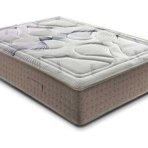 Colchón Memory Visco de 30 cm de altura sobre una base de cama en un dormitorio luminoso, mostrando su acolchado superior.