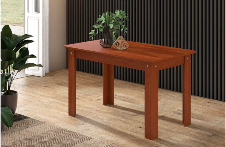 Mesa de comedor extensible modelo Luka con tablero de madera técnica, extendida a 200 cm y decorada para acoger a 10 personas en un comedor familiar moderno y luminoso.