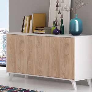 Aparador Soto de diseño moderno en color roble-grafito con puertas y cajones, ubicado en un salón luminoso.