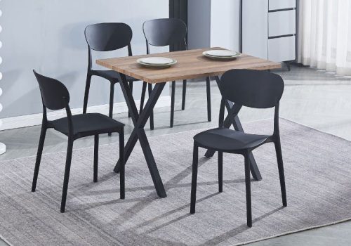 Conjunto de mesa rectangular Videl de MDF con patas negras y 5 sillas negras de polipropileno apilables, perfecto en una cocina moderna y luminosa.