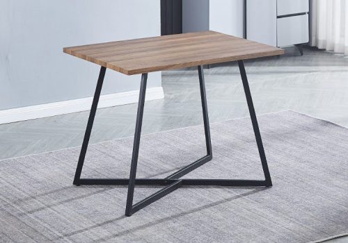 Mesa de cocina fija Kirby blanca de 100x70cm con encimera de madera técnica y patas metálicas negras, situada en una cocina moderna y compacta, ideal para espacios pequeños.
