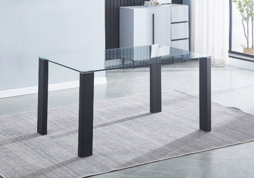 Mesa de comedor fija modelo Alice con tapa de cristal templado transparente y patas metálicas negras, ubicada en un comedor moderno iluminado, acompañada por seis personas compartiendo una comida familiar alegremente.