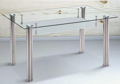 Mesa de comedor Pranzo con tablero de cristal templado ahumado y patas de acero inoxidable para 6 personas, integrada en un ambiente moderno y luminoso, lista para una agradable reunión familiar.