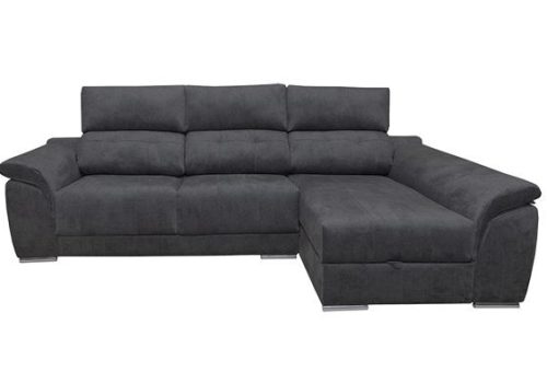 Sofá chaise longue Pirineos de diseño moderno en un salón luminoso, destacando sus respaldos reclinables y el arcón de almacenaje.